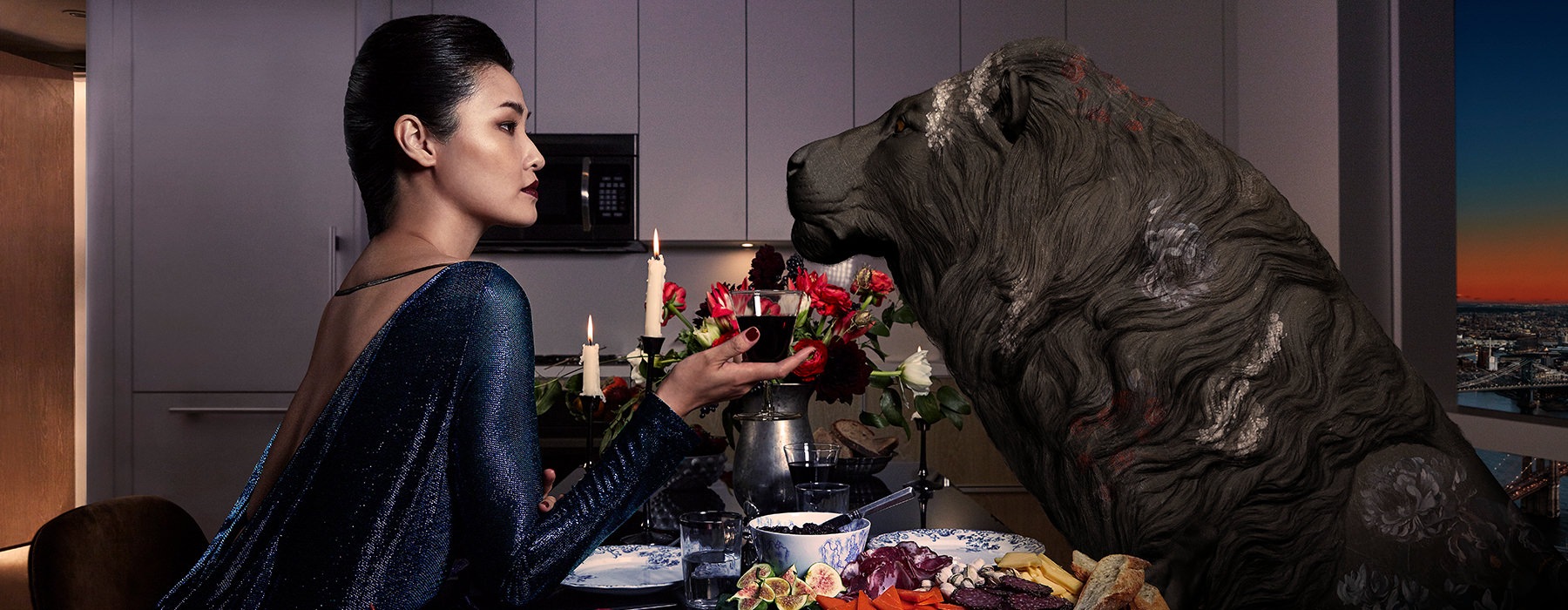 Woman enjoying a dinner with a fake lion 